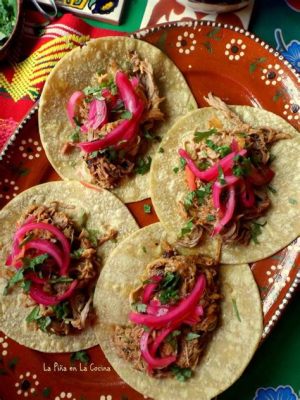  Cochinita Pibil: Smoky and Tender Pork Slow-Roasted in Banana Leaves for a Taste of Yucatan History!